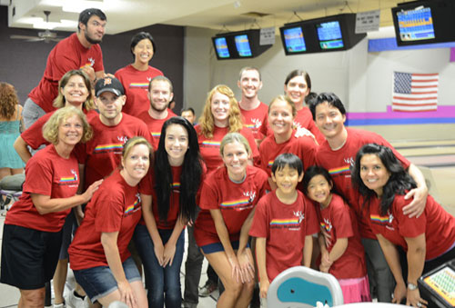 Bowling team posing in the team sponsored event.